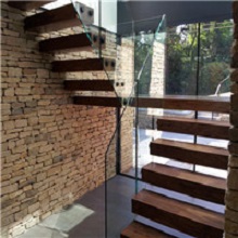 House interior glass railing wood cantilevered stairs