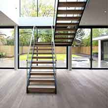 U shaped double beams straight staircase indoor  with glass railing