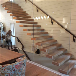 Decorative double stringer straight stairs with cable railing and oak treads