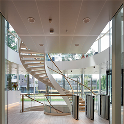 Curved Interior Staircase Duplex Villa Wood and Glass Railing Staircase