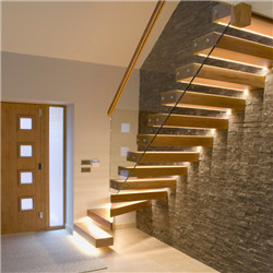 Floating stair enter wall type beam with glass railing staircase